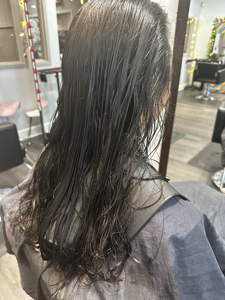 Hair before a layered haircut, seen from behind