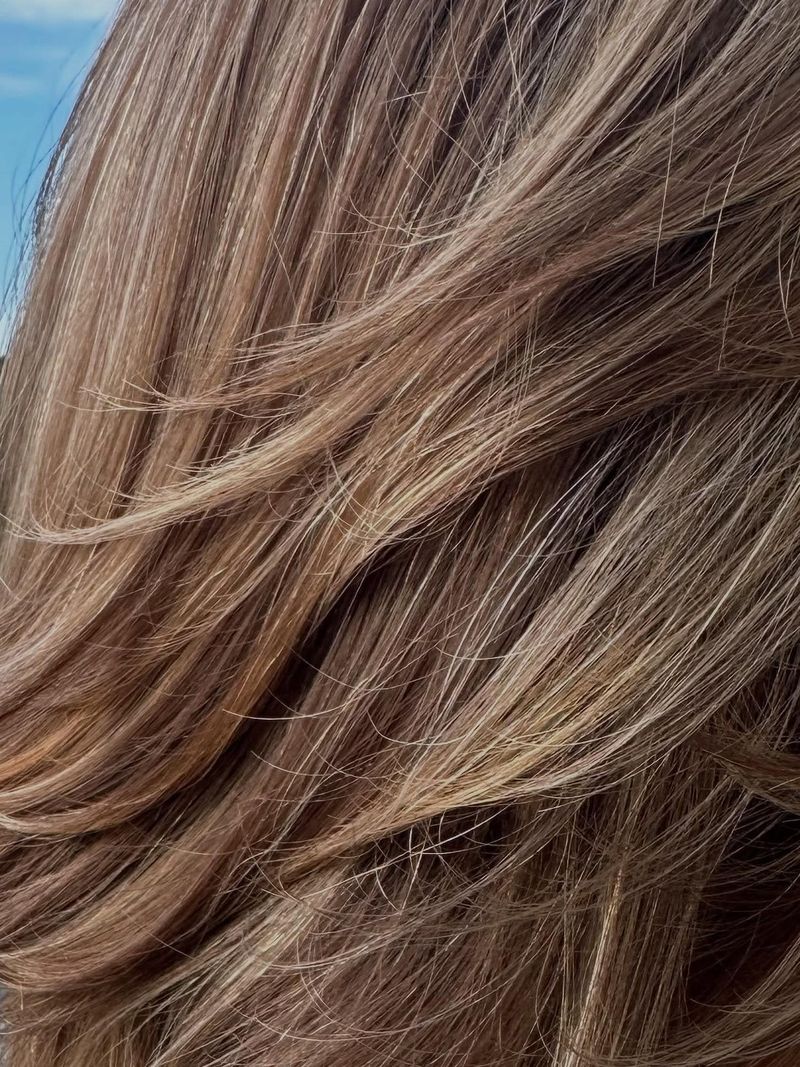 Close up of layered hair with soft partial highlights
