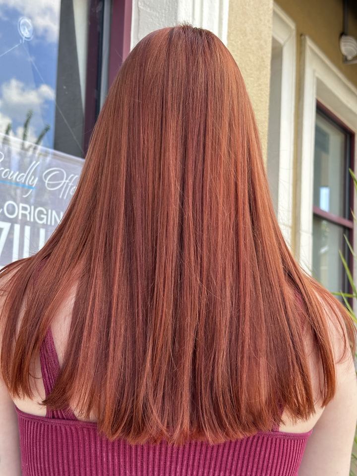 Long straight copper red hair, seen from behind